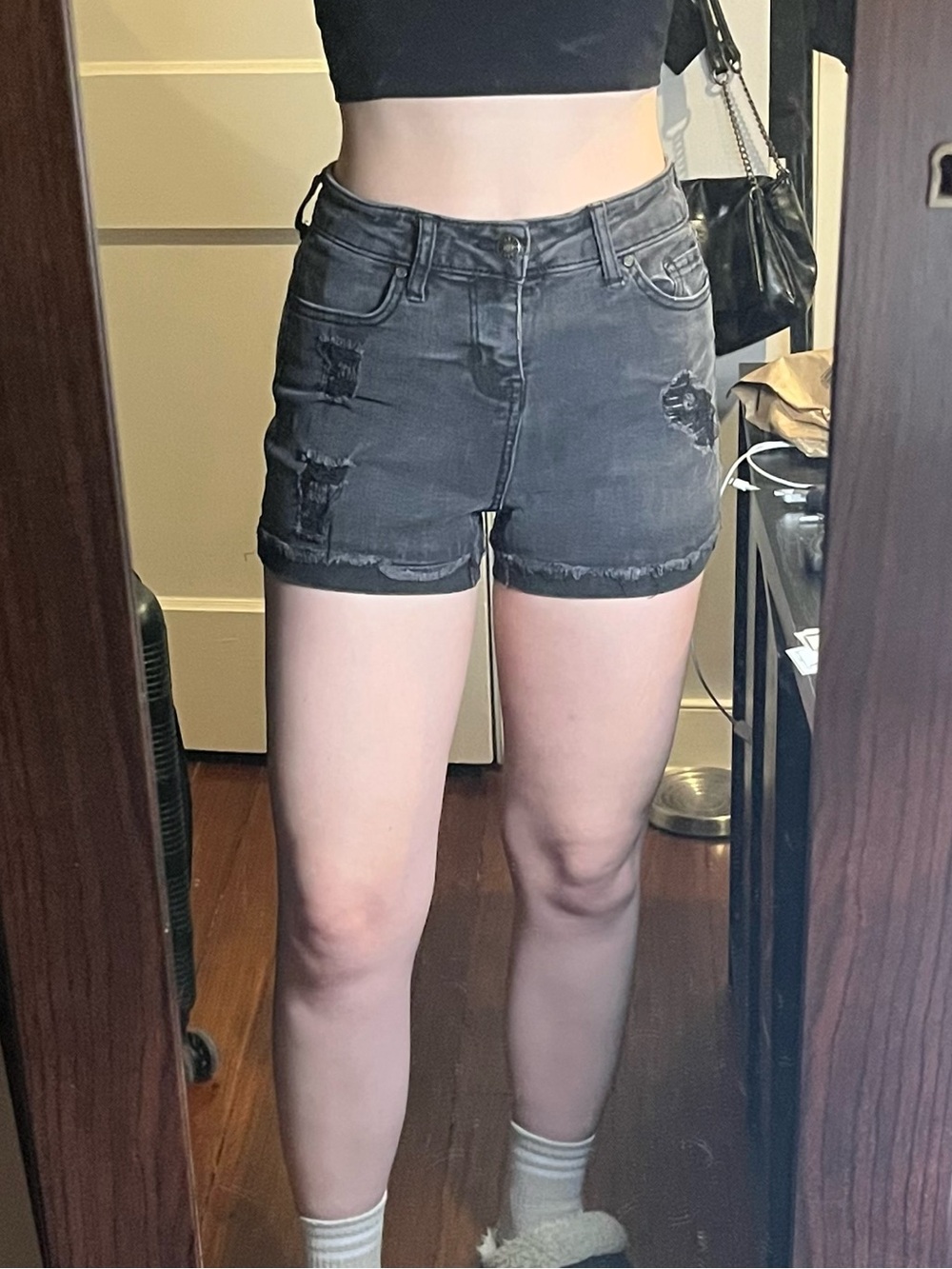 Black distressed jean shorts